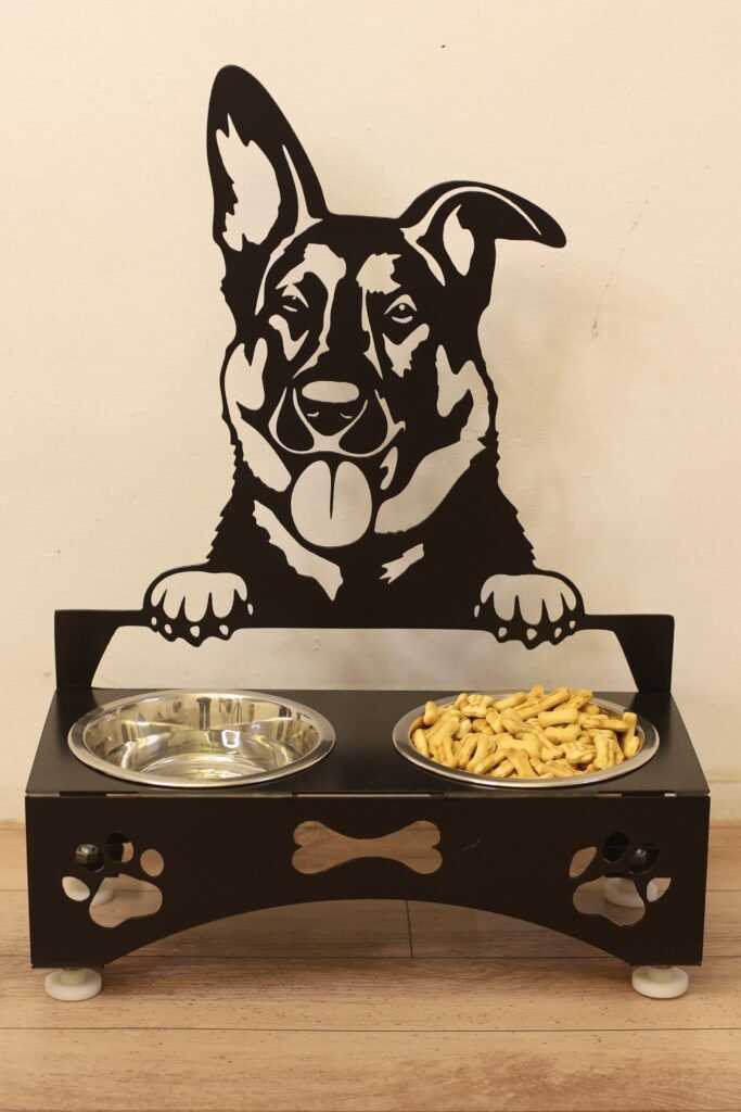 "Metal dog feeding station with a black silhouette of a dog, featuring two stainless steel bowls and adjustable legs for height, designed for durability and style."